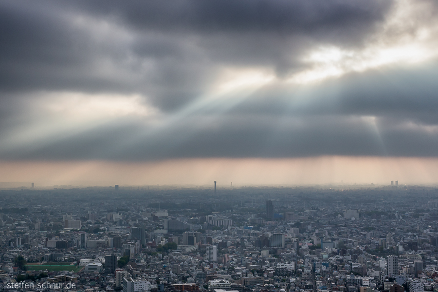 Tokyo
 Japan
 light rays
 clouds
 overview
