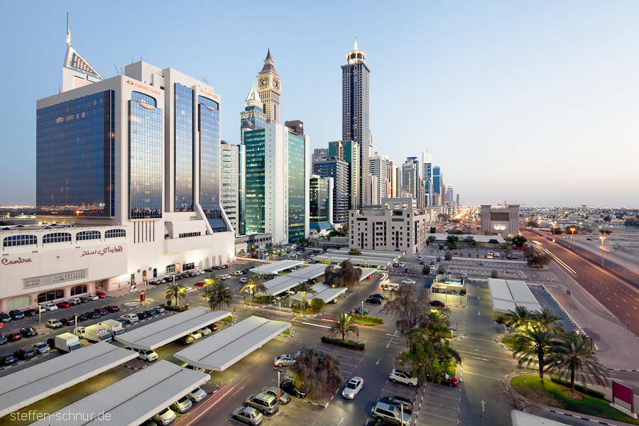 city skyline
 cars
 Crowne Plaza
 Dubai
 skyscrapers
 parking
 UAE
