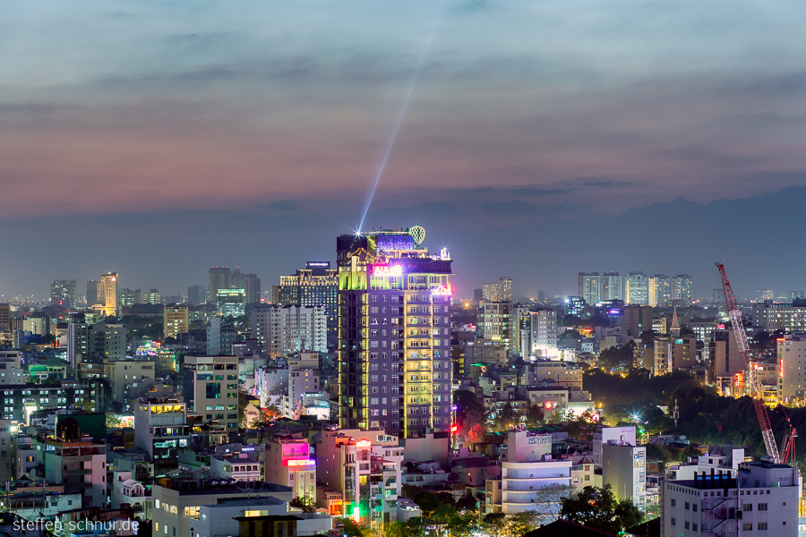 roof top bar
 Ho Chi Minh City
 Saigon
 Vietnam
 high rise
 sea of houses
 crane
