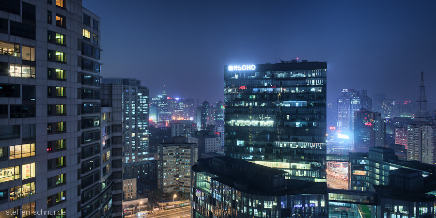 Soho Peking China Bürohaus Fensterfront Hochhäuser Lichter
