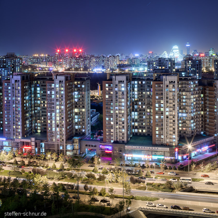 cars
 Peking
 China
 high rise
 lights
 night scene
 advertising
