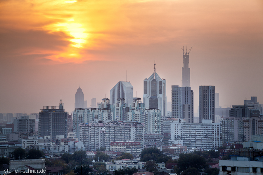 city skyline
 sunset
 Tianjin
 China
 skyscrapers
 sun
 clouds
