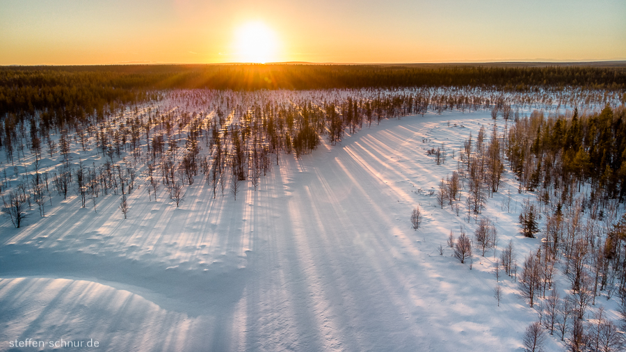 sunset
 Lapland
 Finland
 aerial photograph
 forest
 winter
