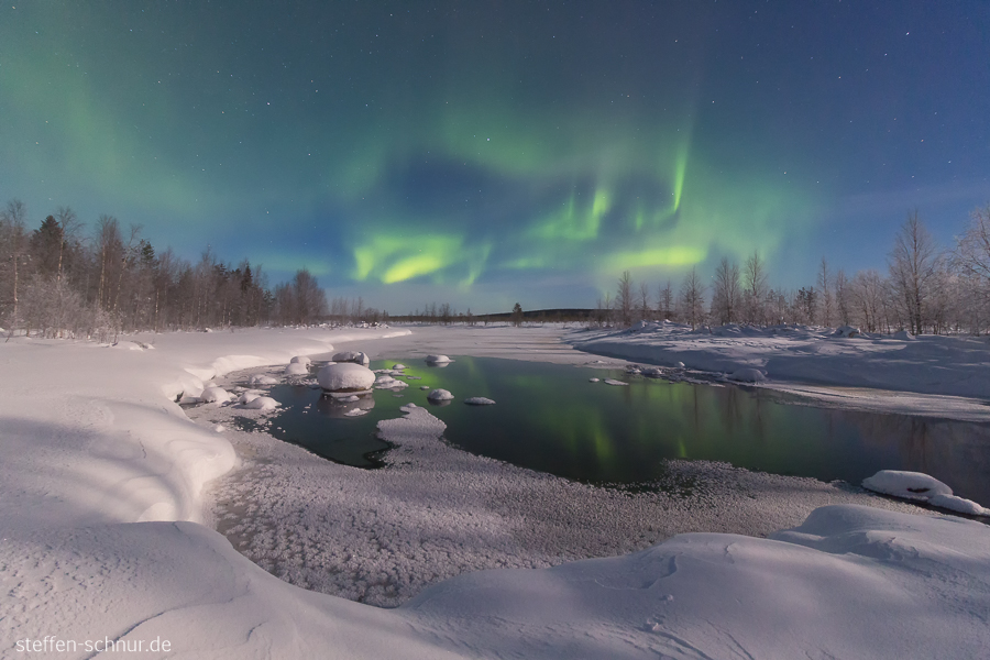 aurora borealis
 snow
 Polar Circle
 Lapland
 Finland
 Trees
 river
