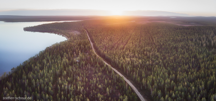 sunrise
 Finland
 panorama view
 lake
 street
 forest
 from above
