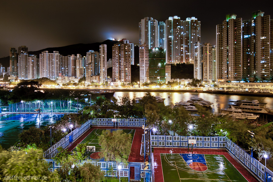 sports ground
 panorama view
 rain
 houses
