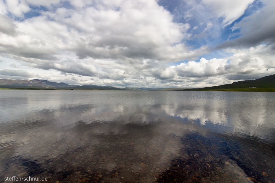 Island Landschaft Spiegelung Steine Wasser Wolken