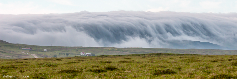 Island Häuser Panorama Welle Wolken