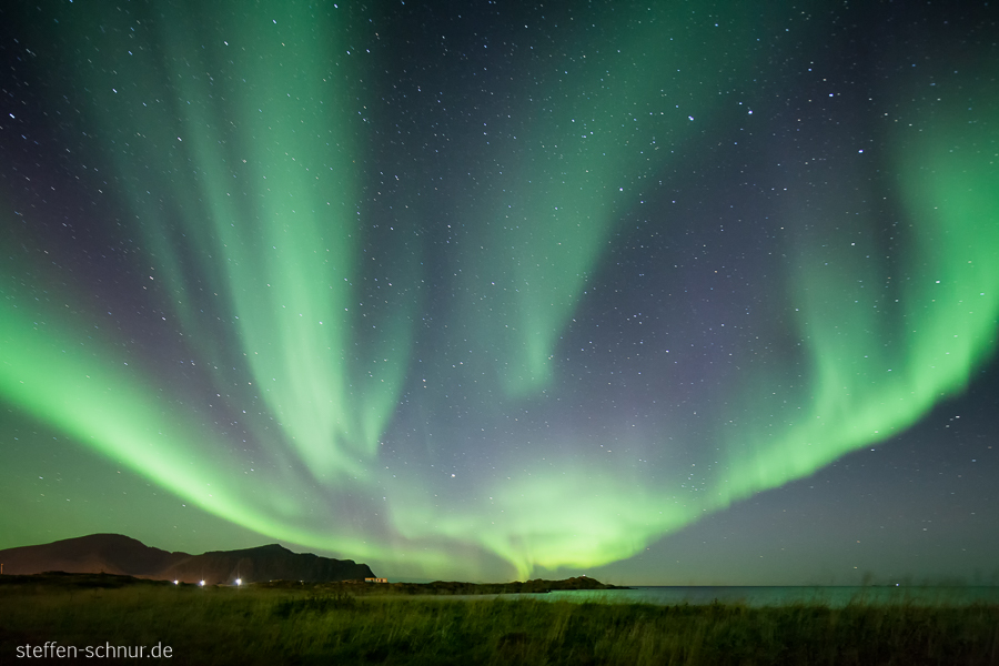 Aurora borealis Berge Flakstadoy Nordland Lofoten Norwegen