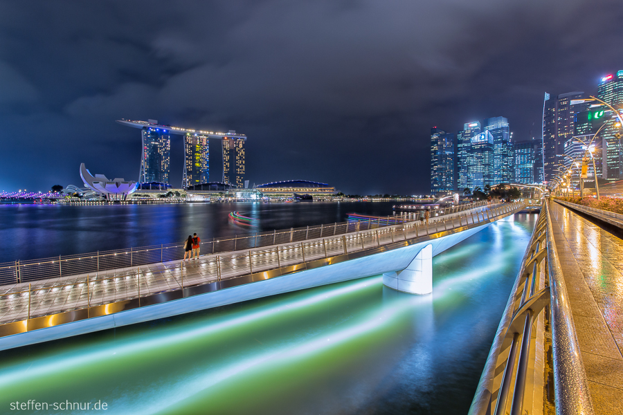 city skyline
 Singapore
 Bridge
 people
 rainy weather
